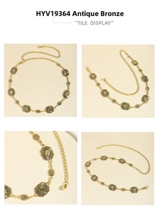 Detail view of vintage bronze metal waist chain with intricate floral patterns and clasp