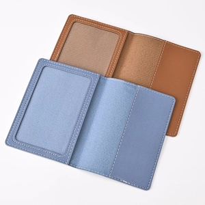 Detail view of leather passport wallet set with internal card slots and ID window