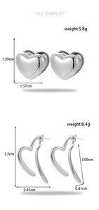 Macro detail of silver heart earrings and oversized hollow hoops with dimensions