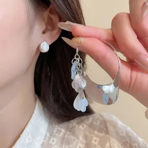 Elegant acrylic flower petal tassel earrings set with blue resin charms for women