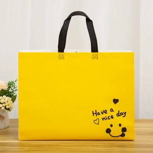 Eco-friendly yellow non-woven shopping bag with black smile face print and handles