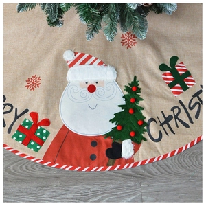 Detail of Christmas tree skirt with Santa Claus applique and Merry Christmas text