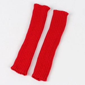Detail of red ribbed knit arm warmer showing textured woolen fabric and elastic cuffs
