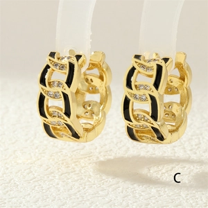 Close-up of 18K gold plated Cuban chain earrings with black enamel and zircon inlay