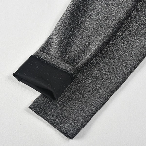 Close-up detail of silver glitter elastic fabric with knit cuffs for sparkly bodysuit