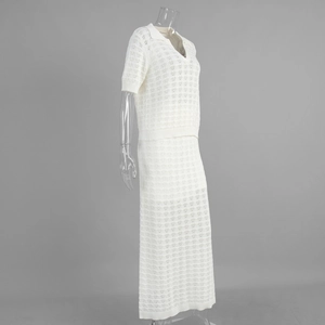 Detail of white hollow knit fabric texture on the short sleeve polo and maxi skirt set
