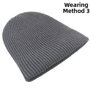 Detailed view of the dark grey ribbed knit beanie showing high-quality fabric texture