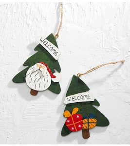 Detail of wooden Christmas tree pendants with Santa Claus and gift box patterns