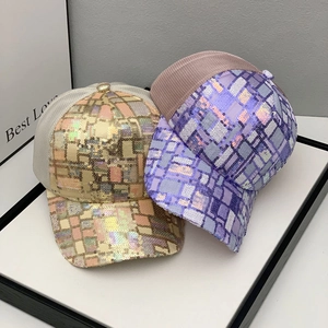Detail of gold and blue purple sequin baseball caps with breathable mesh texture