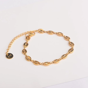 Gold coffee bean link bracelet with K18 tag and adjustable chain on white background