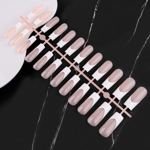 Detail view of 24 pieces French style press-on nails with nude base and white tips