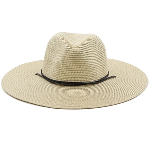 Summer woven straw Panama hat with flat wide brim and brown leather strap on white background