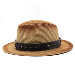 Detail of hand-woven gradient straw hat with studded leather band and vintage rivets