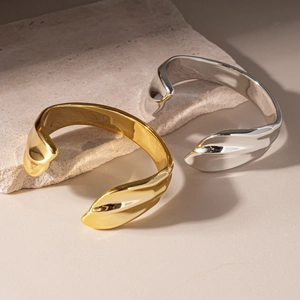 Minimalist irregular geometric open bangles in polished gold and silver finish