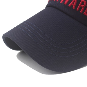 Close-up of navy cotton twill cap featuring red 3D embroidery and reinforced stitching