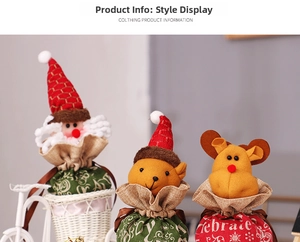 Detail of Christmas drawstring gift bags featuring Santa and reindeer designs