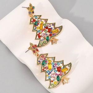 Detail view of gold Christmas tree earrings with colorful crystals and pearls on white base