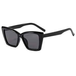 Classic black oversized cat-eye sunglasses with metal hinges and dark grey lenses