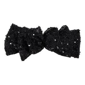 Elegant large black sequin bow hair clip for women featuring shimmering fabric texture