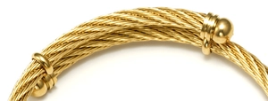 Detailed close-up showing the golden woven spiral texture of the 18K steel bracelet