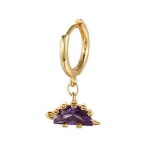 Detailed close-up of a golden dinosaur earring with a purple faceted crystal drop charm