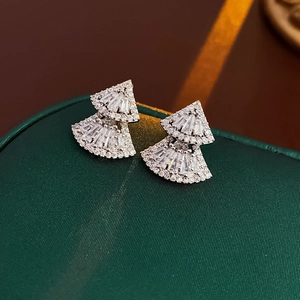 Detailed macro view of fan-shaped double earrings with silver zircon micro-pave setting