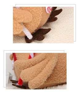 Close-up of felt gingerbread man Christmas ornament with red and white candy details