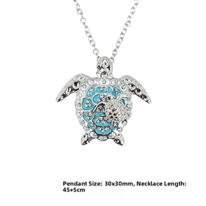 Detailed view of turtle pendant necklace with blue enamel and rhinestone 30x30mm