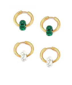 Detailed view of gold plated titanium earrings with green malachite and white turquoise stones