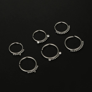 Set of 6 silver 20G surgical steel nose rings featuring small metal beads and clear zircon gems