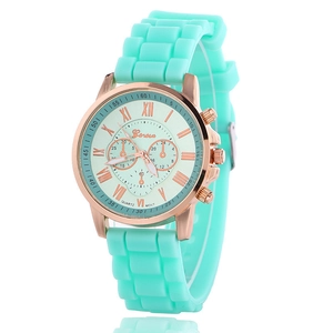 Close-up of Geneva quartz watch with mint green silicone strap and rose gold metal case