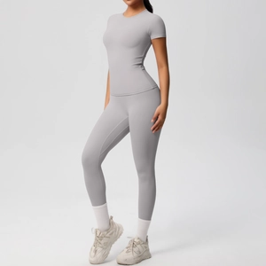 Close-up of light gray two-piece yoga set showing breathable brushed fabric texture