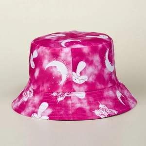 Detail of mushroom and butterfly print on tie-dye pink reversible sun bucket hat