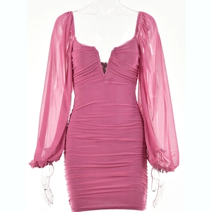Close-up of pink V-neck mesh mini dress featuring long sleeves and pleated details