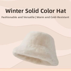 Detail of plush faux fur texture on a cream winter bucket hat for warmth and style