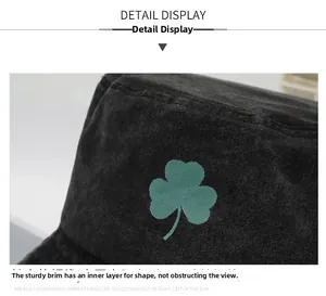 Detail view of the firm brim and layered structure on a green clover embroidered bucket hat