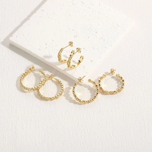Three pairs of 14K gold plated irregular hoop earrings with textured zircon accents