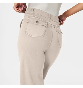 Close-up of high-waist apricot casual pants featuring buttoned flap back pockets and twill cotton