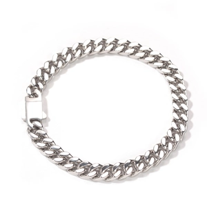Polished silver stainless steel Cuban link bracelet with spring clasp on white background
