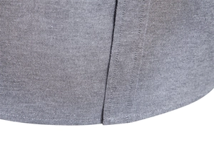 Macro view of grey oxford shirt fabric showing fine texture and precision hem stitching