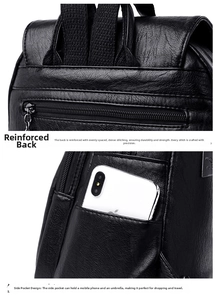 Detail view of the reinforced stitching and side pocket on the black faux leather backpack