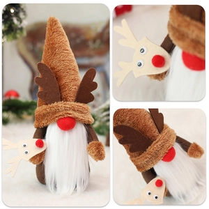 Detail of Christmas reindeer gnome featuring brown antlers and white plush beard ornaments