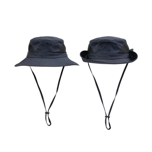 Detail of navy sun hat featuring breathable mesh, Traveler embroidery and adjustable chin strap