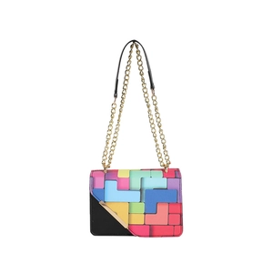 Chic crossbody bag with colorful geometric patchwork design and golden metal chain strap