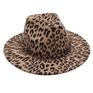 Close-up of leopard print fedora hat with felt texture and decorative metal buckle belt