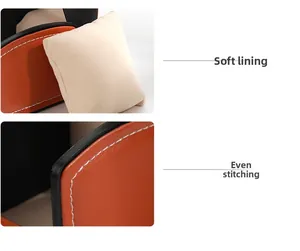 Detailed view of orange PU leather watch box featuring soft beige lining and neat stitching