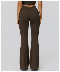Detail view of high-waisted flared yoga pants with V-shaped stitching and lifting effect