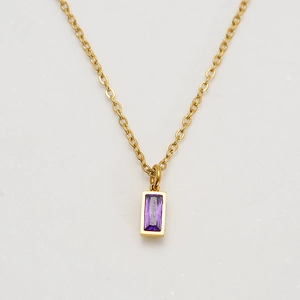 Detailed close-up of 18K gold-plated titanium chain with a purple rectangular gemstone pendant