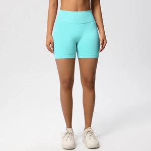 Detail of high waist seamless fitness shorts in mint green showing flexible rib texture