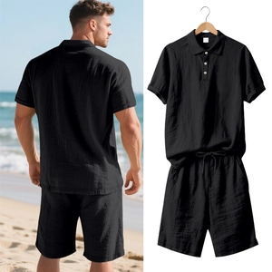 Black linen-blend polo and shorts set featuring waffle texture and drawstring waist